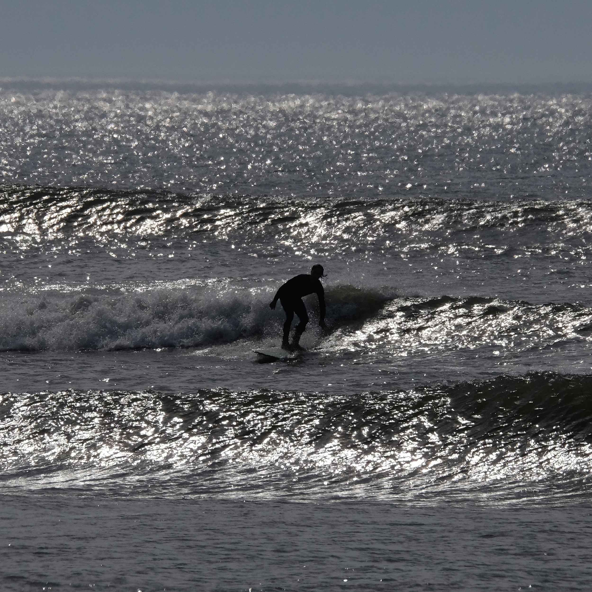 SilhouettedSurfer 23MAY21 CabeRdExRyeNH web SilhouettedSurfer-23MAY21-CableRdExtRyeNH